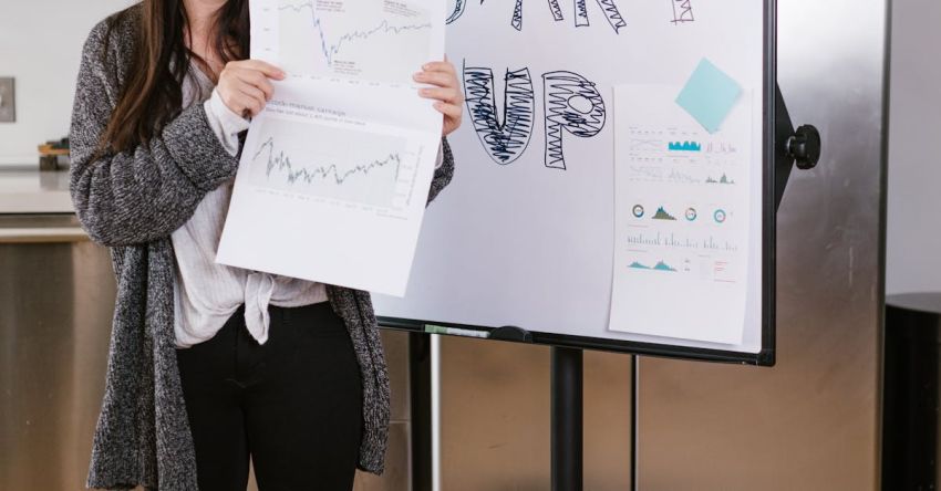 Crowdfunding - Woman in Gray Coat Holding White Printer Paper