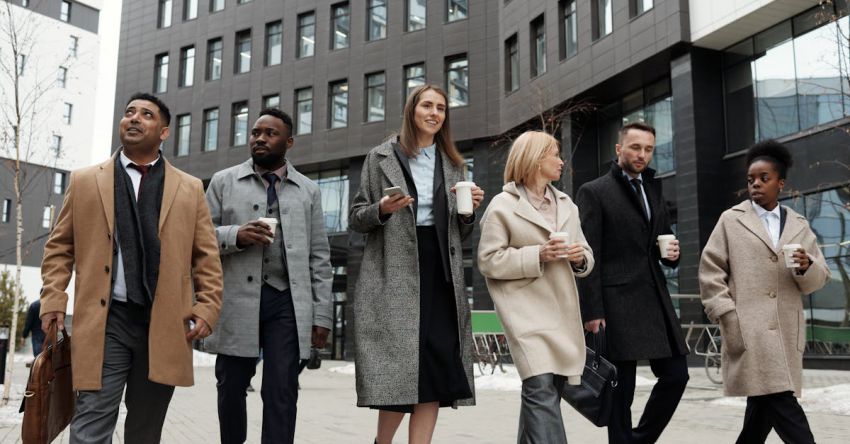 Leaders - Coworkers Taking a Coffee Break and Walking