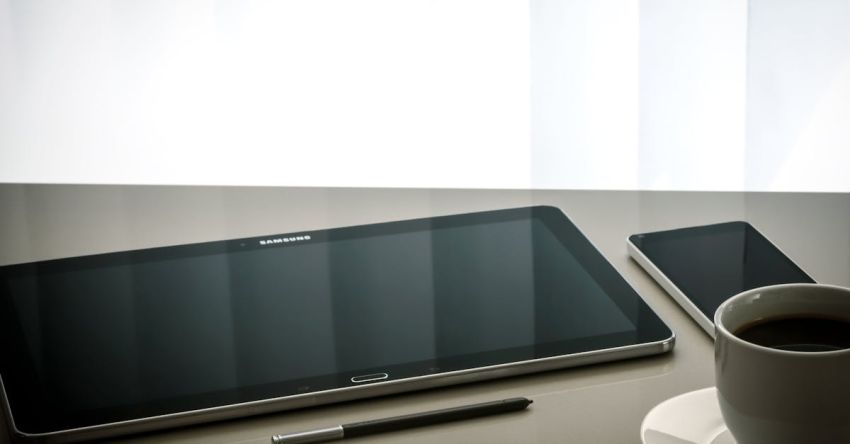 Management - Black Samsung Android Tablet Computer Beside Stylus Pen